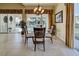 Bright dining room with glass table and pool view at 13477 Coluccio St, Venice, FL 34293