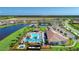 Aerial view showing resort-style pool, clubhouse, and tennis courts at 13756 Vadini St, Venice, FL 34293