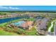 Aerial view of community amenities including pool, tennis courts, and clubhouse at 13756 Vadini St, Venice, FL 34293
