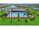 Community pool and clubhouse with surrounding landscaping at 13756 Vadini St, Venice, FL 34293