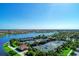 Tennis courts with lake and community view at 13756 Vadini St, Venice, FL 34293