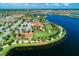 Community with lake, clubhouse, and walking paths at 13756 Vadini St, Venice, FL 34293
