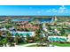 Community pool and clubhouse with lush landscaping at 13756 Vadini St, Venice, FL 34293