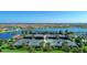 Tennis courts and clubhouse near a lake at 13756 Vadini St, Venice, FL 34293