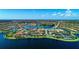 Aerial view of a community with lakefront homes and a clubhouse at 13756 Vadini St, Venice, FL 34293