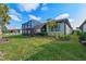 Home features a large backyard with screened lanai at 13756 Vadini St, Venice, FL 34293