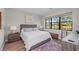 Spacious bedroom with water view and wood furniture at 13756 Vadini St, Venice, FL 34293