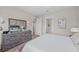 Bright bedroom with dresser and large bed at 13756 Vadini St, Venice, FL 34293