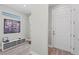 Modern entryway with wood-look floors and interior door at 13756 Vadini St, Venice, FL 34293