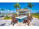 Relaxing fire pit area with seating, perfect for outdoor gatherings at 13756 Vadini St, Venice, FL 34293
