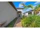 Front entry with a brick walkway and lush landscaping at 13756 Vadini St, Venice, FL 34293
