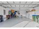 Spacious garage with storage shelving and bicycle at 13756 Vadini St, Venice, FL 34293
