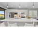 Modern kitchen with white cabinets and quartz countertops at 13756 Vadini St, Venice, FL 34293