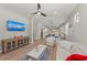 Open concept living area with hardwood floors and access to kitchen at 13756 Vadini St, Venice, FL 34293