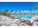 Large community pool with plenty of lounge chairs at 13756 Vadini St, Venice, FL 34293