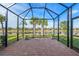 Enjoy the outdoors in this screened lanai with lake view at 13756 Vadini St, Venice, FL 34293