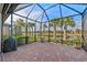 Spacious screened lanai overlooking a peaceful lake at 13756 Vadini St, Venice, FL 34293