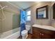 Clean bathroom with shower/tub combo, vanity, and updated tile floor at 151 Morningside Rd, Venice, FL 34293