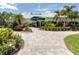 Waterford Sports Club entrance with stone walkway and landscaping at 1579 Waterford Dr, Venice, FL 34292