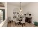 Elegant dining room features a round glass table and four chairs at 1579 Waterford Dr, Venice, FL 34292