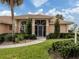 Attractive front entry with screened porch and walkway at 1579 Waterford Dr, Venice, FL 34292