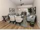 Comfortable living room with light gray sofas, coffee table and access to the patio at 1579 Waterford Dr, Venice, FL 34292