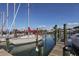 Boats docked at a marina with calm water at 1579 Waterford Dr, Venice, FL 34292