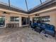 Outdoor patio features a covered lanai, comfortable seating, and a bar area at 1579 Waterford Dr, Venice, FL 34292
