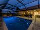 Enclosed pool area with lighting at 1579 Waterford Dr, Venice, FL 34292