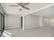 Living room with hardwood floors and access to another room at 1591 Beach Rd # 204, Englewood, FL 34223