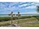 Stunning water view with lush greenery and palm trees at 1591 Beach Rd # 204, Englewood, FL 34223