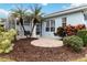 Charming backyard patio with landscaping and seating area at 1634 Monarch Dr # 1634, Venice, FL 34293