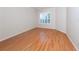 Large bedroom with hardwood floors and plantation shutters at 1634 Monarch Dr # 1634, Venice, FL 34293