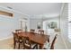 Spacious dining room, hardwood table and chairs, access to patio at 1634 Monarch Dr # 1634, Venice, FL 34293