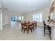 Dining area with hardwood table and chairs, open to kitchen at 1634 Monarch Dr # 1634, Venice, FL 34293
