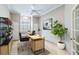 Home office with built-in shelving, desk, and large window at 1634 Monarch Dr # 1634, Venice, FL 34293