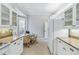 Kitchen nook with a glass table and wicker chairs near a window at 1634 Monarch Dr # 1634, Venice, FL 34293