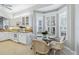 Kitchen nook with wicker chairs and a glass table at 1634 Monarch Dr # 1634, Venice, FL 34293