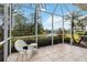 Screened patio overlooking a tranquil lake and lush landscape at 1634 Monarch Dr # 1634, Venice, FL 34293