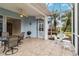 Covered patio with seating area, grill, and access to the interior at 1634 Monarch Dr # 1634, Venice, FL 34293