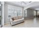 Sunroom with sofa, plantation shutters, and view to backyard at 1634 Monarch Dr # 1634, Venice, FL 34293