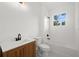 Bathroom boasts a soaking tub, vanity with wood cabinets, and tile flooring at 18055 Dublin Ave, Port Charlotte, FL 33948