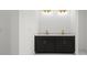 Double vanity bathroom with dark cabinetry and gold accents at 18055 Dublin Ave, Port Charlotte, FL 33948