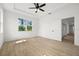 Spacious bedroom with tile floors and two windows at 18055 Dublin Ave, Port Charlotte, FL 33948