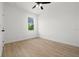 Bright bedroom with tile floors and a window offering natural light at 18055 Dublin Ave, Port Charlotte, FL 33948