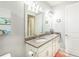 Clean bathroom with double vanity and granite countertop at 18891 Lanuvio St, Venice, FL 34293