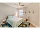 Comfortable bedroom with a light teal bedding set and ocean decor at 18891 Lanuvio St, Venice, FL 34293