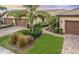 Three-unit villa building with attached garages and manicured landscaping at 18891 Lanuvio St, Venice, FL 34293