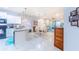 Open concept kitchen with granite countertops and stainless steel appliances at 18891 Lanuvio St, Venice, FL 34293