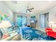 Coastal living room featuring comfortable seating and a large TV at 18891 Lanuvio St, Venice, FL 34293